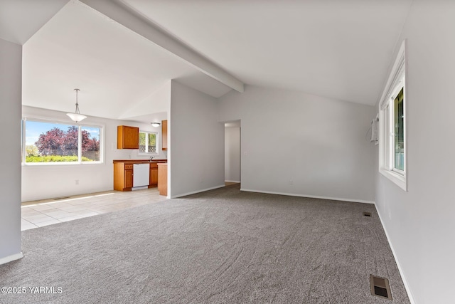202 N 80th Ave, Yakima, WA 98908 - unfurnished living room featuring light tile patterned floors, lofted ceiling with beams, visible vents, baseboards, and light carpet