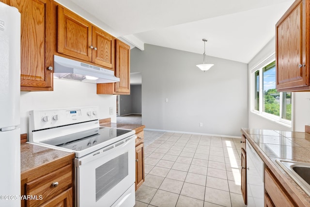 202 N 80th Ave, Yakima, WA 98908 - kitchen with lofted ceiling, white appliances, brown cabinets, decorative light fixtures, and under cabinet range hood