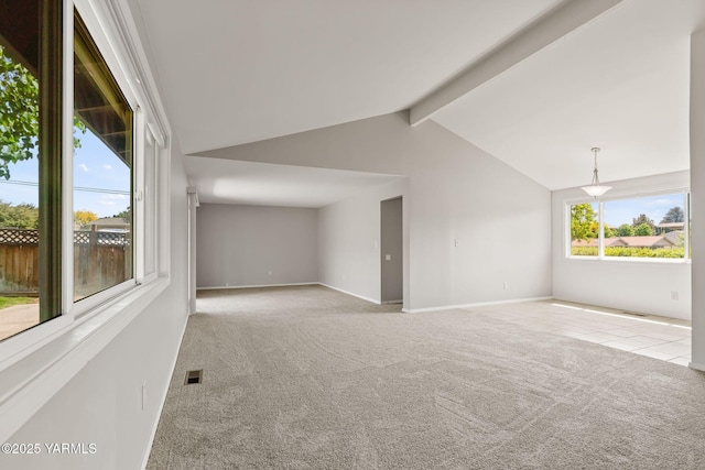 202 N 80th Ave, Yakima, WA 98908 - carpeted empty room featuring visible vents, baseboards, and lofted ceiling with beams