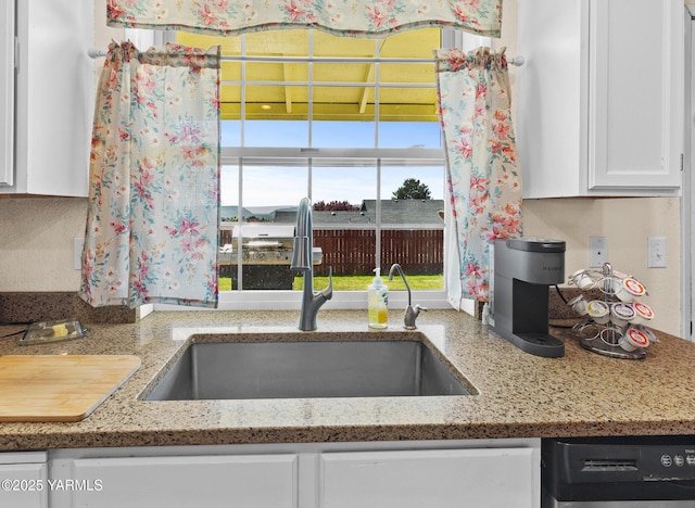 5602 Mount Clemens Way, Yakima, WA 98901 - kitchen featuring dishwashing machine, white cabinetry, and light stone countertops