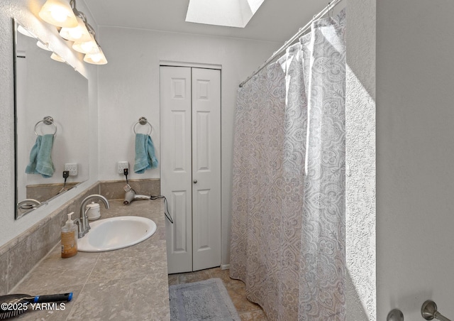 5602 Mount Clemens Way, Yakima, WA 98901 - bathroom featuring a closet, a skylight, and vanity