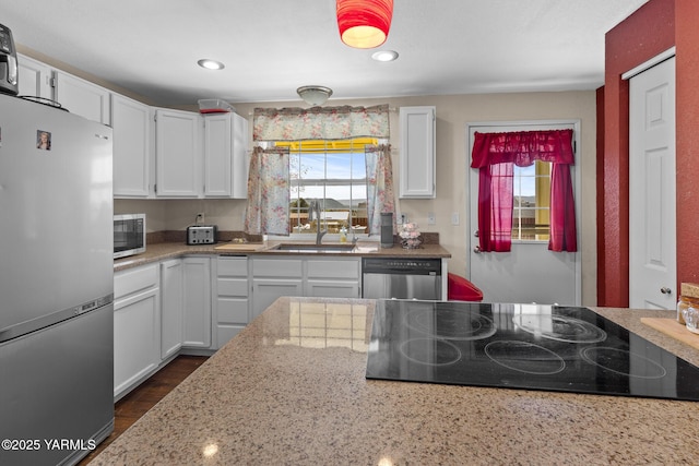 5602 Mount Clemens Way, Yakima, WA 98901 - kitchen featuring stainless steel appliances, plenty of natural light, white cabinetry, light stone countertops, and recessed lighting