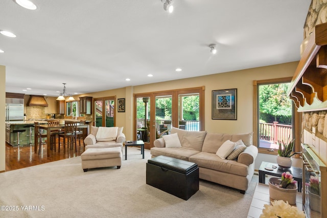 living area featuring recessed lighting and a fireplace