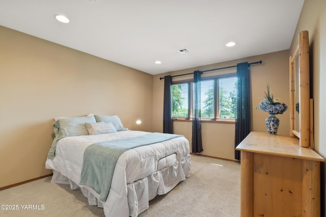 bedroom with recessed lighting, visible vents, baseboards, and light colored carpet