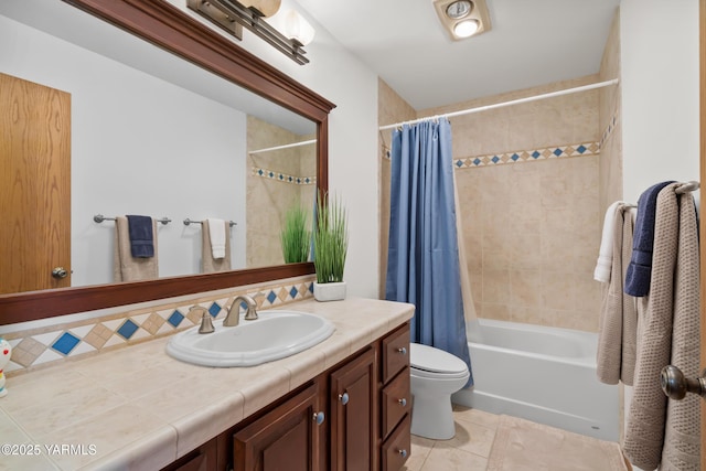 full bathroom featuring shower / bathtub combination with curtain, toilet, vanity, and tile patterned flooring