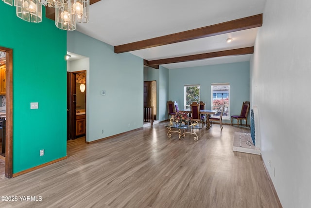 24 Crest Cir, Yakima, WA 98908 - living area with a chandelier, wood finished floors, and beam ceiling