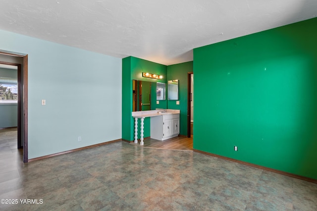 24 Crest Cir, Yakima, WA 98908 - unfurnished bedroom featuring a sink and connected bathroom