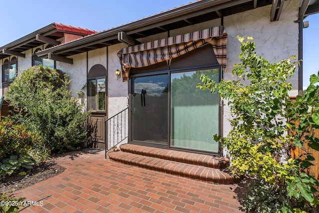 24 Crest Cir, Yakima, WA 98908 - view of exterior entry featuring stucco siding and a patio