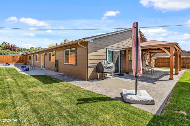 5910 W Lincoln Ave Unit 36, Yakima, WA 98908 - back of house with a gazebo, a patio, and a chimney