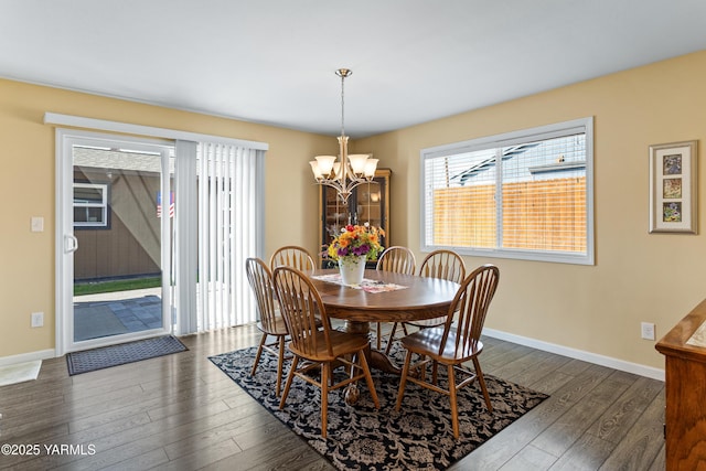 5910 W Lincoln Ave Unit 36, Yakima, WA 98908 - dining room featuring dark wood-type flooring, a chandelier, and baseboards