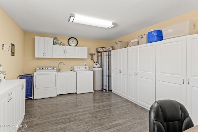 5910 W Lincoln Ave Unit 36, Yakima, WA 98908 - laundry room featuring washer and clothes dryer, cabinet space, and dark wood-type flooring