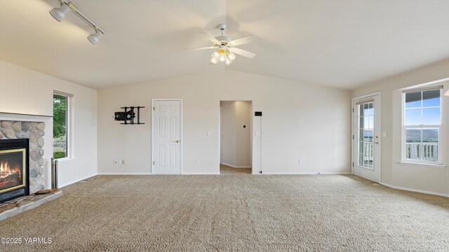 40 Vista Verde Dr, Yakima, WA 98901 - unfurnished living room featuring carpet, lofted ceiling, baseboards, a fireplace, and ceiling fan