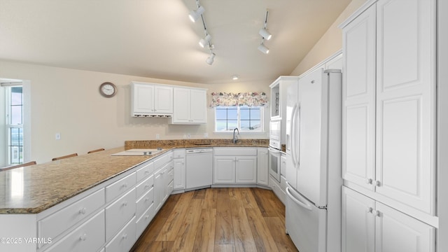 40 Vista Verde Dr, Yakima, WA 98901 - kitchen with white appliances, white cabinets, wood finished floors, stone counters, and a peninsula