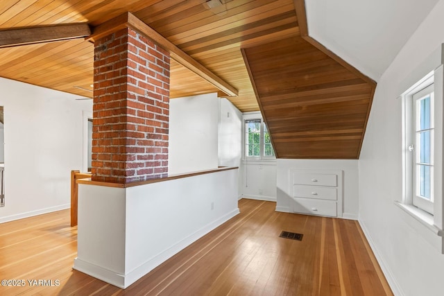 additional living space featuring wood ceiling, baseboards, lofted ceiling, and hardwood / wood-style floors
