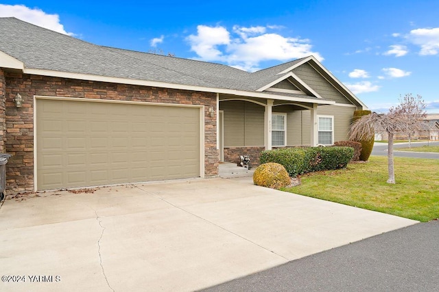 single story home with a garage, a shingled roof, concrete driveway, a front lawn, and a porch