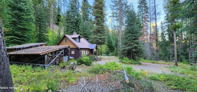 30711 Hwy 410, Naches, WA 98937 - view of side of home with a chimney and a view of trees