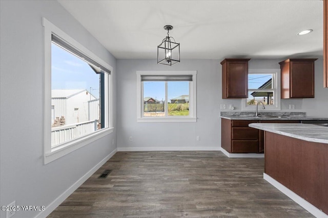 101 Hickory Ln, Selah, WA 98942 - kitchen with dark wood finished floors, hanging light fixtures, a chandelier, and recessed lighting