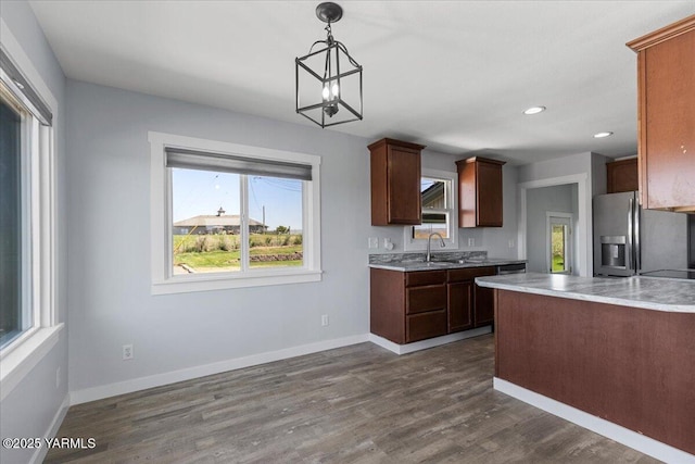 101 Hickory Ln, Selah, WA 98942 - kitchen featuring stainless steel fridge with ice dispenser, light countertops, dark wood-style flooring, pendant lighting, and recessed lighting