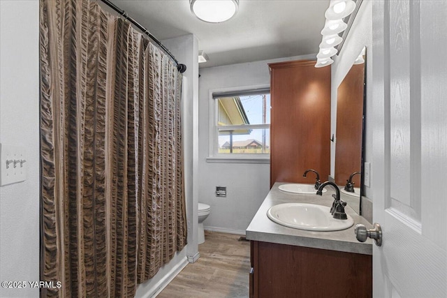 101 Hickory Ln, Selah, WA 98942 - full bathroom with double vanity, wood finished floors, and a shower with curtain
