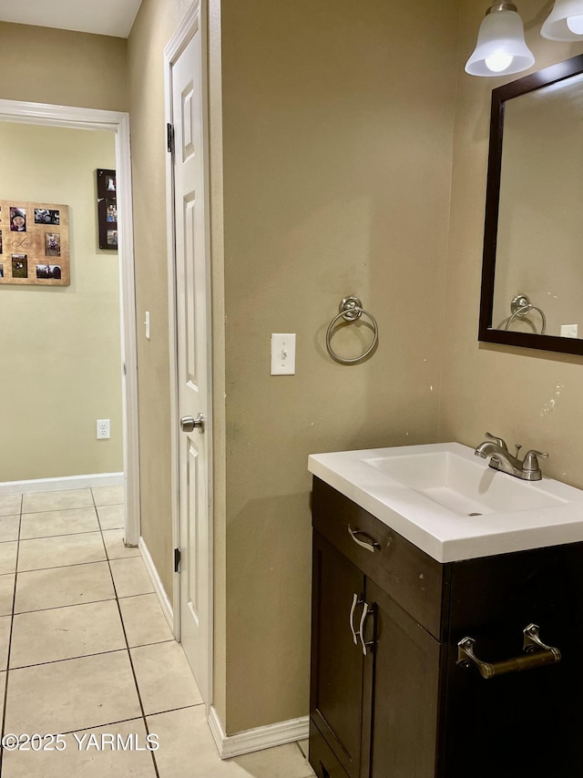 106 S G St, Toppenish, WA 98948 - bathroom with tile patterned floors, baseboards, and vanity