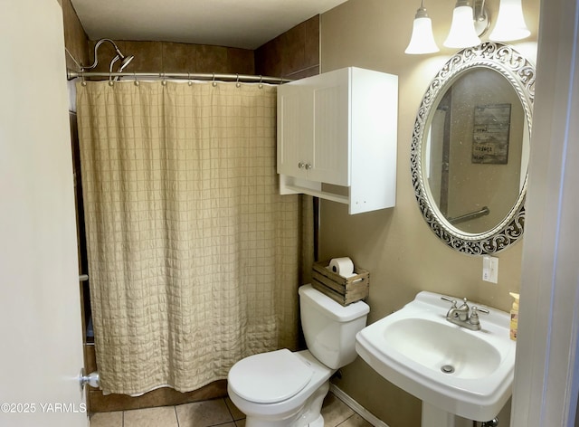106 S G St, Toppenish, WA 98948 - bathroom featuring a sink, curtained shower, toilet, and tile patterned flooring
