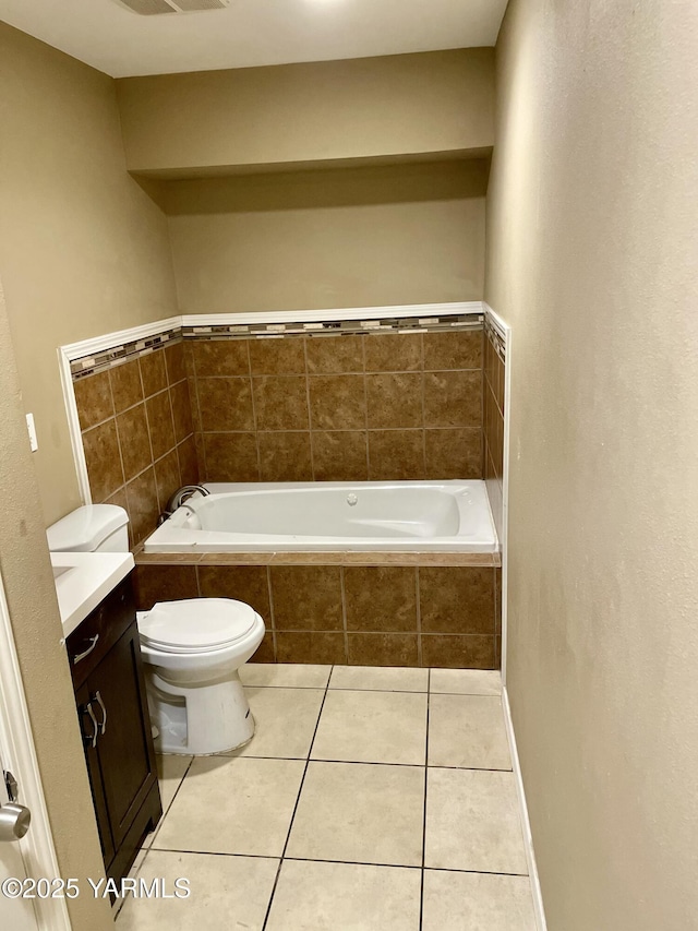 106 S G St, Toppenish, WA 98948 - bathroom with tile patterned flooring, vanity, toilet, and a bath