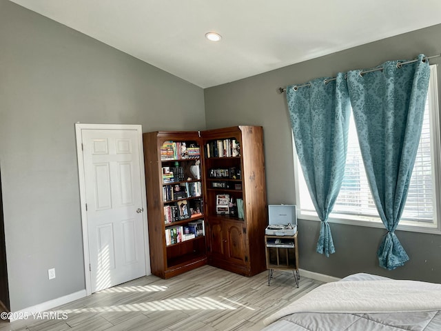 106 S G St, Toppenish, WA 98948 - bedroom with baseboards, wood finished floors, and vaulted ceiling