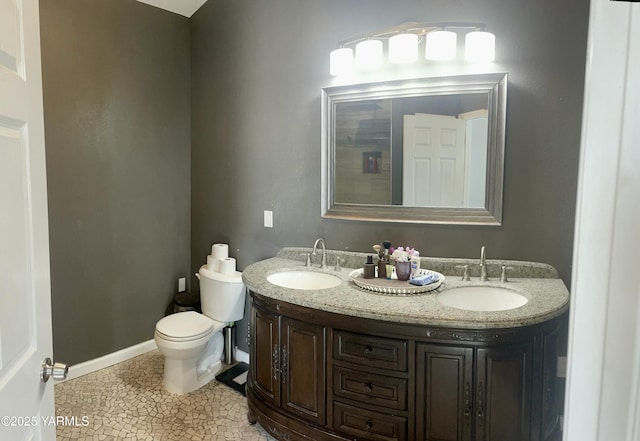 106 S G St, Toppenish, WA 98948 - full bath with double vanity, toilet, baseboards, and a sink