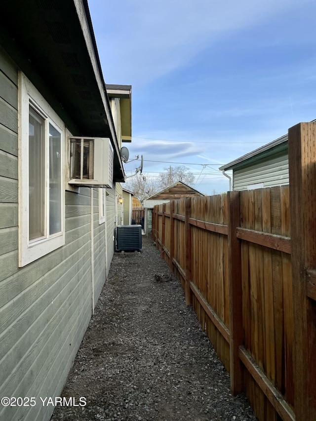106 S G St, Toppenish, WA 98948 - view of home's exterior featuring central AC and fence