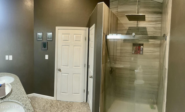 106 S G St, Toppenish, WA 98948 - bathroom featuring a shower stall, double vanity, and baseboards
