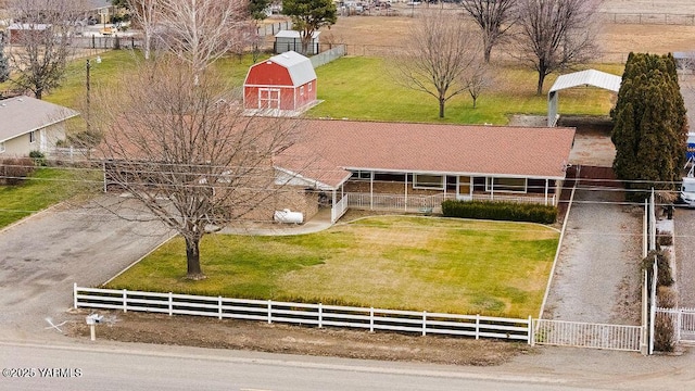 birds eye view of property with a rural view