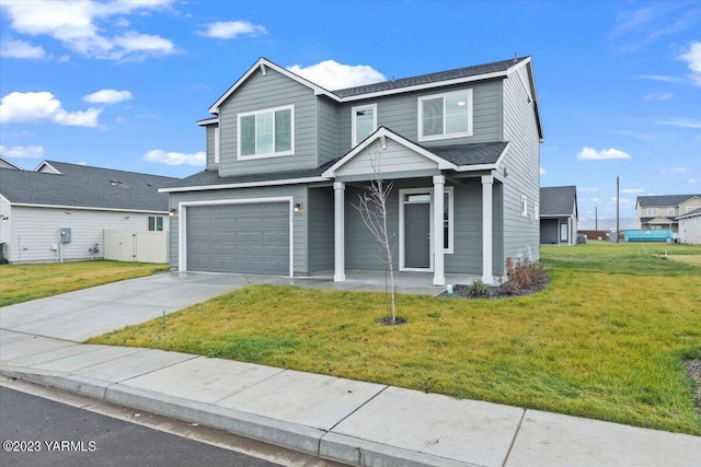 traditional home with an attached garage, a front lawn, concrete driveway, and roof with shingles