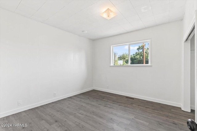 1203 E Chestnut Ave, Yakima, WA 98901 - spare room featuring wood finished floors and baseboards