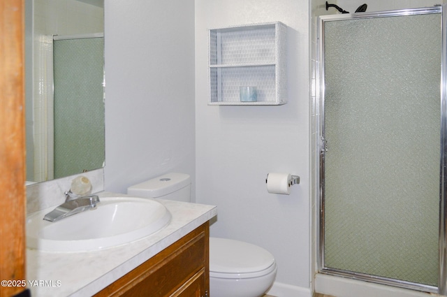 full bathroom with toilet, vanity, and a shower stall