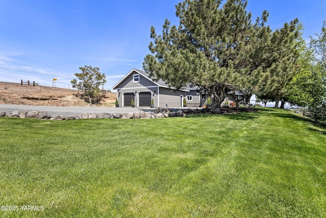 12826 Douglas Rd, Yakima, WA 98908 - view of front facade with a front yard, driveway, and an attached garage