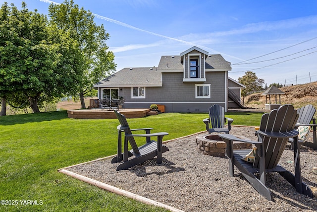 12826 Douglas Rd, Yakima, WA 98908 - rear view of property featuring an outdoor fire pit, roof with shingles, a yard, and a deck