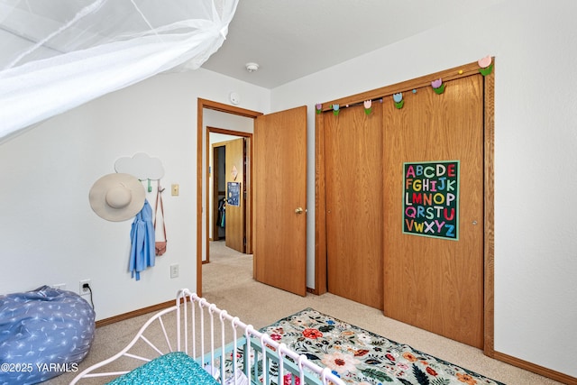 12826 Douglas Rd, Yakima, WA 98908 - bedroom featuring light colored carpet, lofted ceiling, a closet, and baseboards