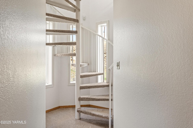 12826 Douglas Rd, Yakima, WA 98908 - staircase featuring carpet flooring, a textured wall, plenty of natural light, and baseboards