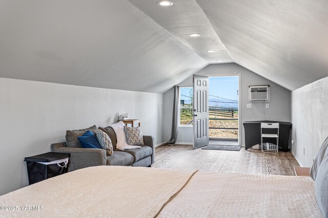 12826 Douglas Rd, Yakima, WA 98908 - bedroom featuring vaulted ceiling, wood finished floors, recessed lighting, a wall unit AC, and baseboards