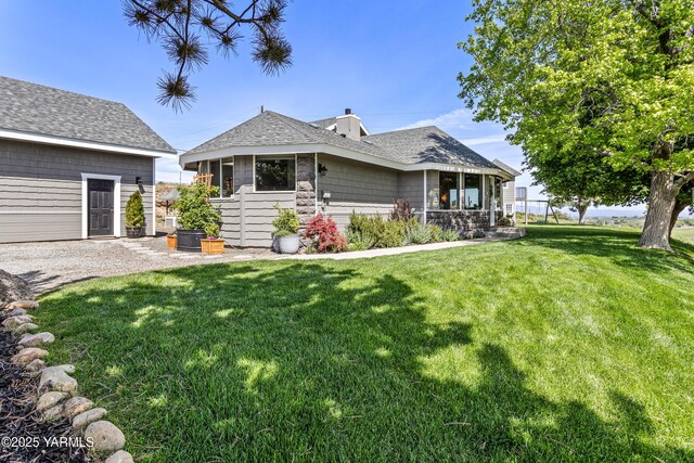 12826 Douglas Rd, Yakima, WA 98908 - view of front of home featuring a front lawn, a chimney, and a shingled roof