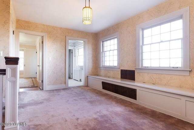 bathroom featuring wallpapered walls