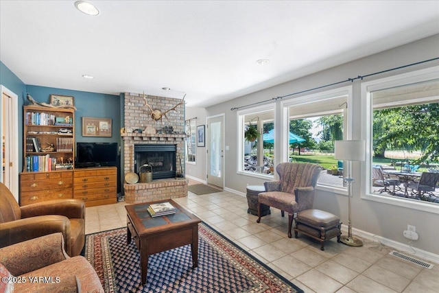 621 Friedline Rd, Yakima, WA 98908 - tiled living area featuring healthy amount of natural light, a brick fireplace, and recessed lighting