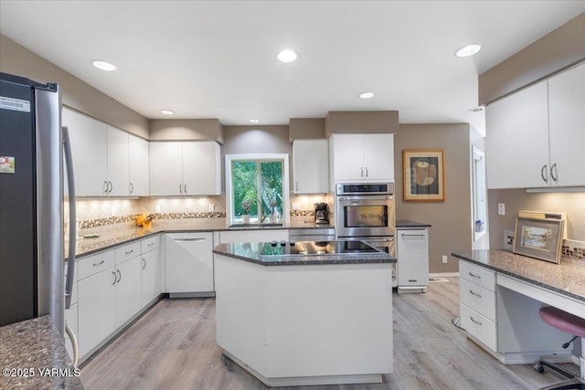 621 Friedline Rd, Yakima, WA 98908 - kitchen featuring freestanding refrigerator, light wood-style floors, decorative backsplash, white cabinets, and recessed lighting