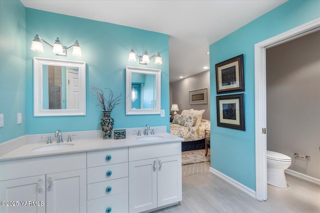 621 Friedline Rd, Yakima, WA 98908 - bathroom featuring double vanity, wood finished floors, and recessed lighting