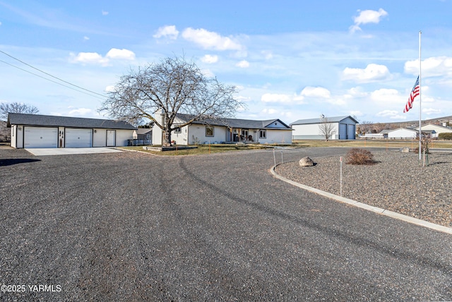 view of front of home with a garage and a residential view