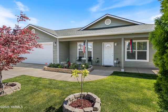 single story home with a garage, a fire pit, roof with shingles, and a front yard