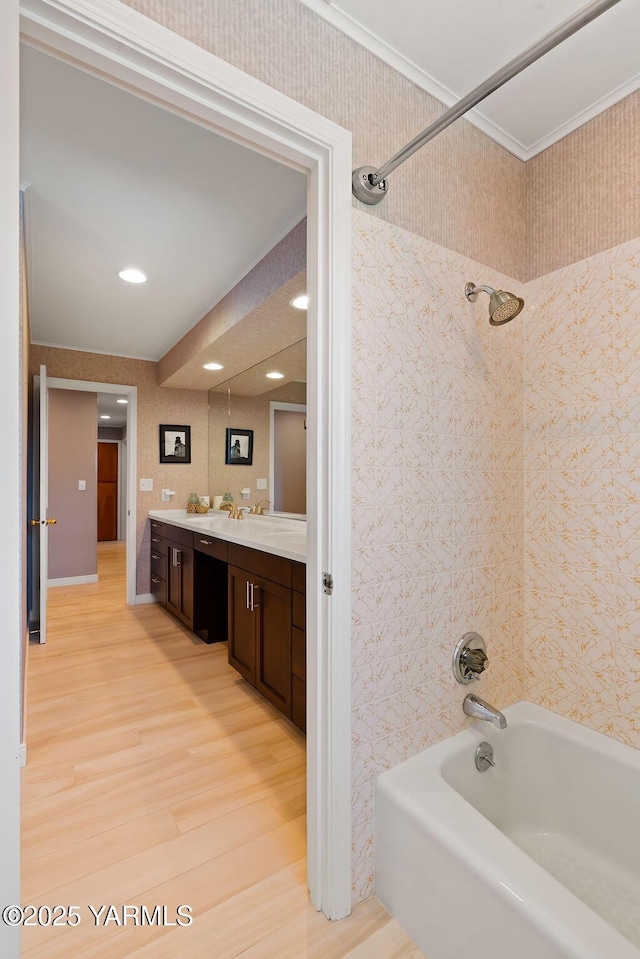 5310 W Lincoln Ave, Yakima, WA 98908 - bathroom featuring shower / tub combination, vanity, wood finished floors, crown molding, and wallpapered walls