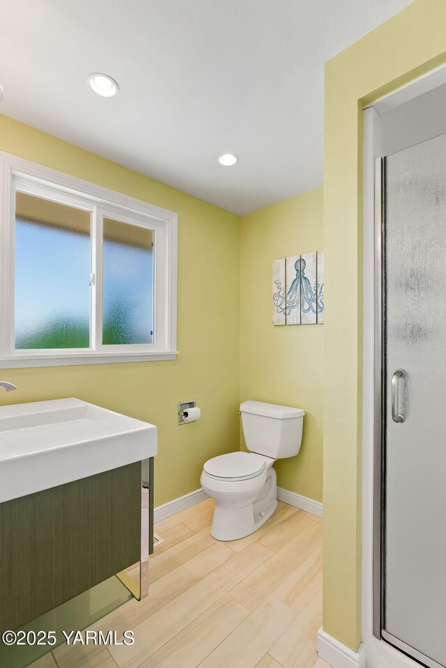 5310 W Lincoln Ave, Yakima, WA 98908 - full bathroom with a stall shower, recessed lighting, and wood finished floors