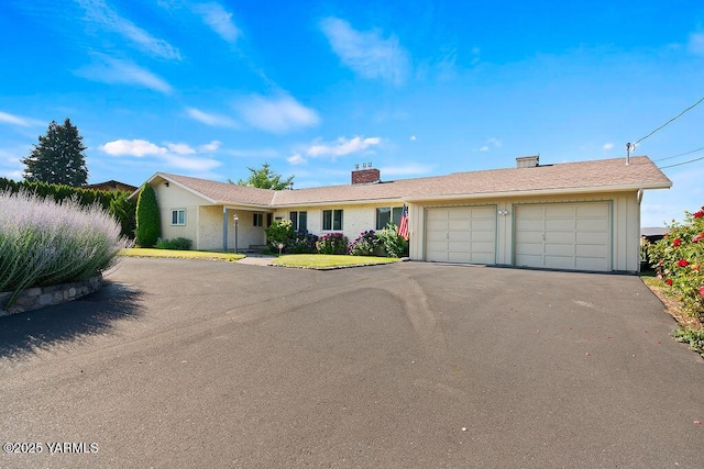 5310 W Lincoln Ave, Yakima, WA 98908 - ranch-style house featuring an attached garage, driveway, and a chimney