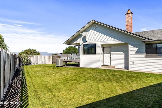 5504 Pear Butte Dr, Yakima, WA 98901 - rear view of property featuring a fenced backyard and a chimney